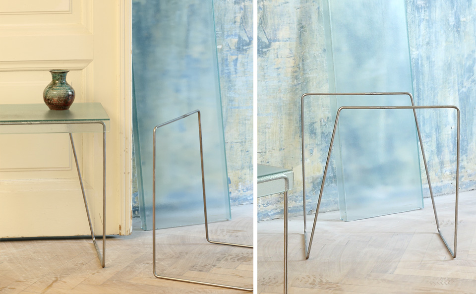 Wohndesign - Tisch mit gebogenem Metallgestellt und Glasplatte